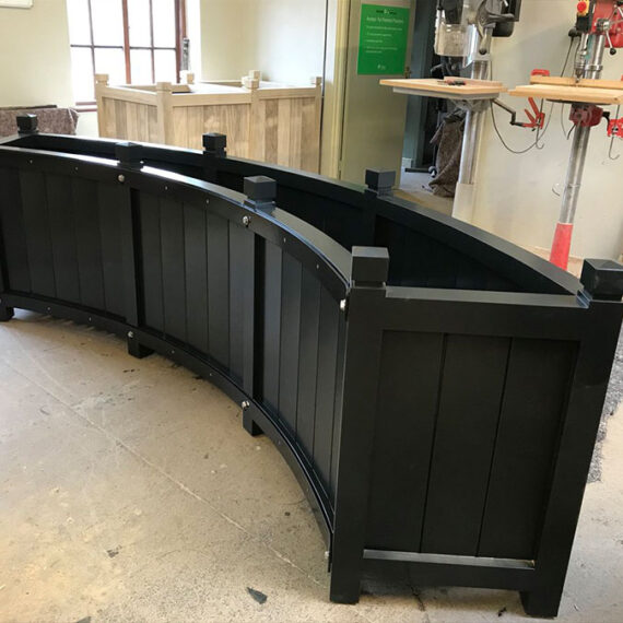 black painted bespoke curved trough planter