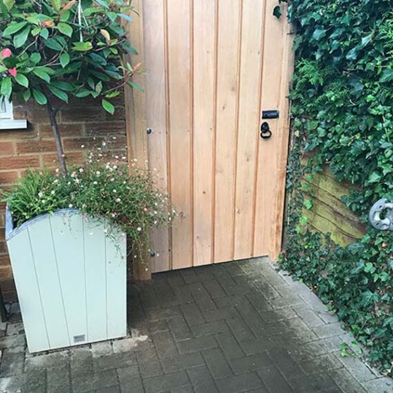 solid hardwood garden gate with planter