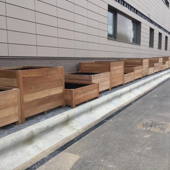 unpainted hardwood planters in a line