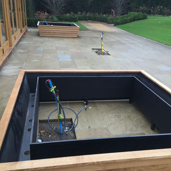 large trough planters being installed