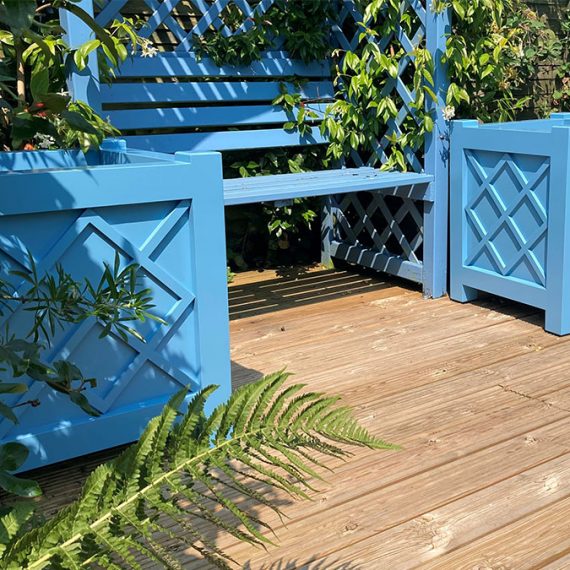 diamond design wooden planters painted blue in the Cotswolds