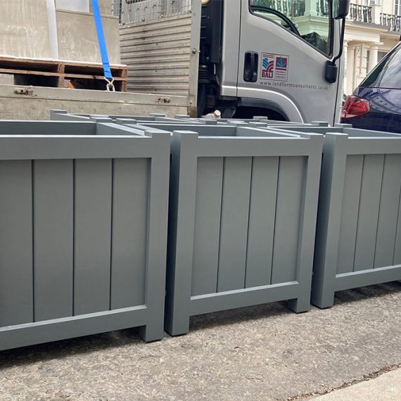 large wooden cube planters painted grey in London