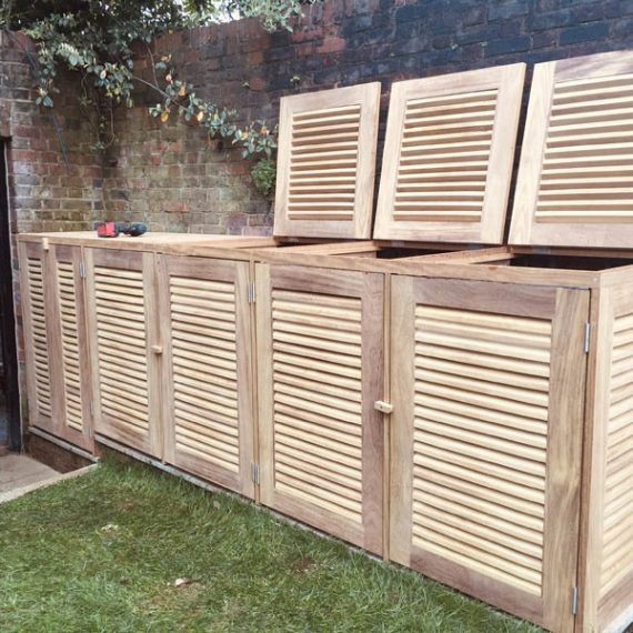 Luxury bespoke slatted louvred bin store made in oak for multiple wheelie bins.