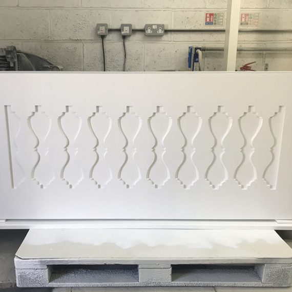 Bespoke made-to-order white Accoya trough planter featuring a traditional decorative cutout balustrade panel design, handcrafted in the UK by Oxford Planters for luxury estate terraces and balconies.