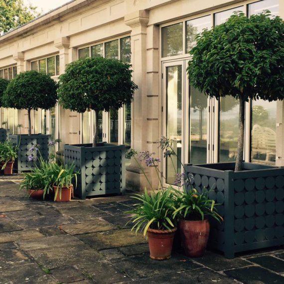 Bespoke large Accoya orangery planters with circle motif detail
