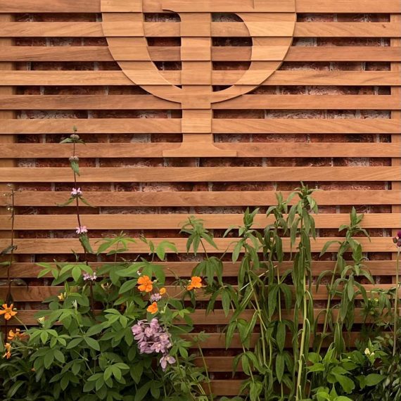 Linear trellis with hand shaped and logo