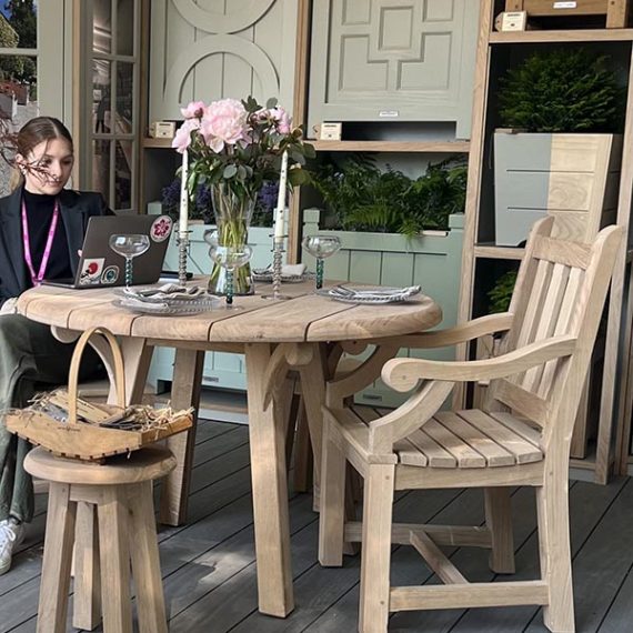 Bespoke solid oak round garden table and matching carvers set at RHS Chelsea Flower Show.