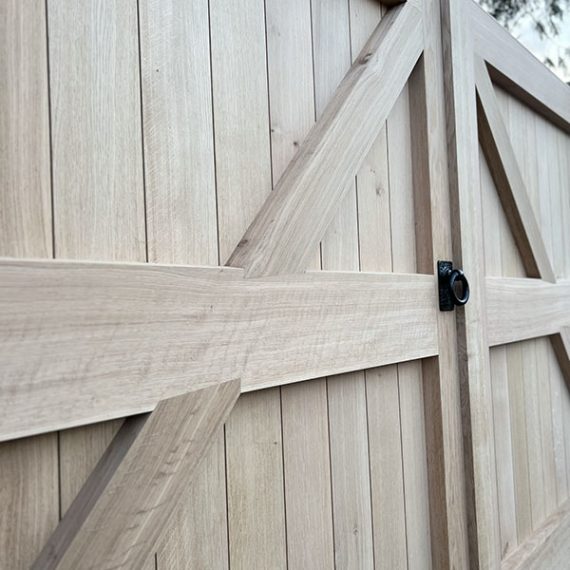 Bespoke replication of luxury Arts and Crafts double estate gates, handcrafted from premium unvarnished hardwood with traditional framing