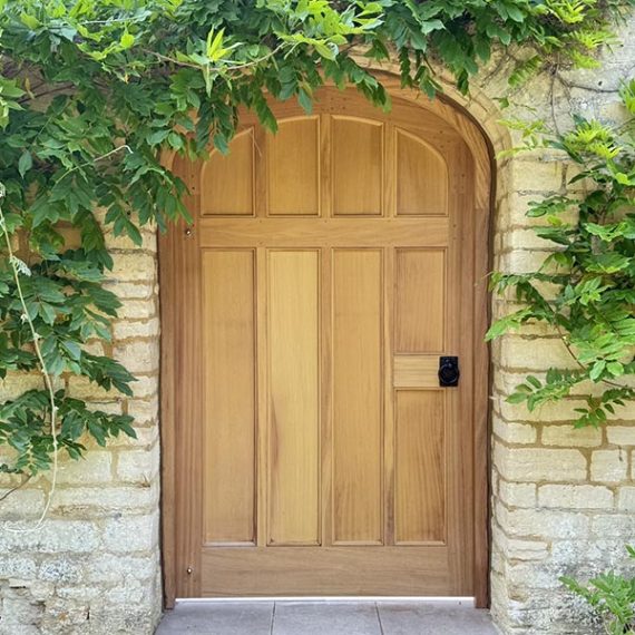 Bespoke replication of a luxury Georgian arched timber estate gate, handcrafted in a classical period style with traditional hardwood joinery.