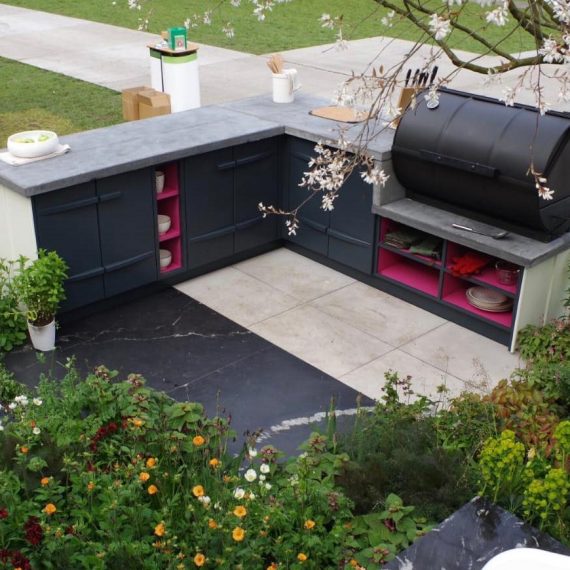 Fluted bespoke outdoor kitchen with white pink and grey hues