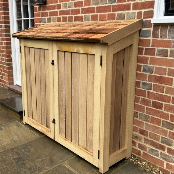 Luxury hardwood outdoor storage cupboard with cedar shingle roof