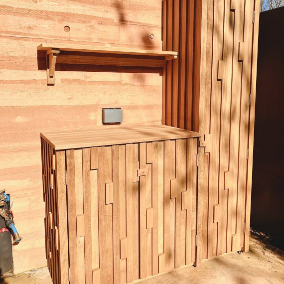 Bespoke outdoor cupboard and storage with shelving in oak and hardwood with unique luxury detailing.