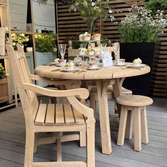 Traditional carver and table set at Chelsea Flower show.