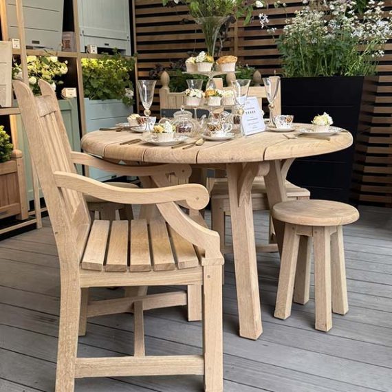 Traditional carver and table set at Chelsea Flower show.