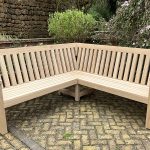 Bespoke, substantial L-shaped corner oak bench in a classic slatted style.