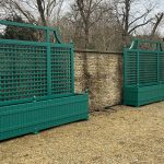 Extra large emerald green Versailles long Trough Planters with trellis in a private courtyard.