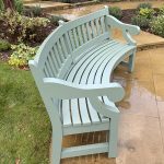 Sage green painted Accoya timber curved three-seater bench with scrolled armrests
