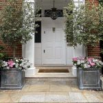 Weathered hand-cast townhouse lead planters