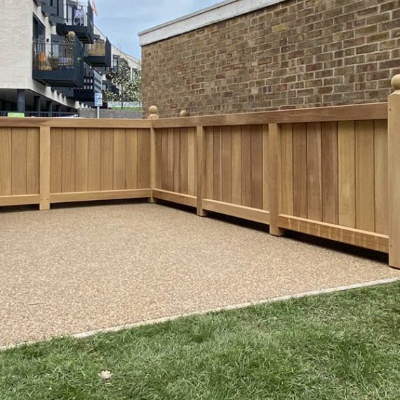 Bespoke luxury L-shaped oak planter handcrafted from hardwood with integral ball finials, configured as a large corner trough planter.