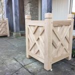 Contemporary Oak wooden entrance planters with lattice detailing at a country estate