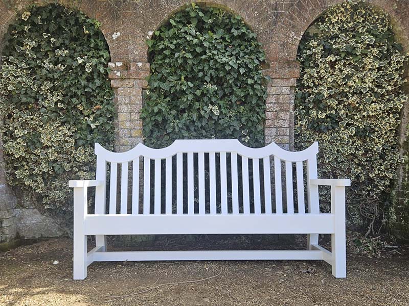 National Trust Accoya bench in a gothic architectural style.